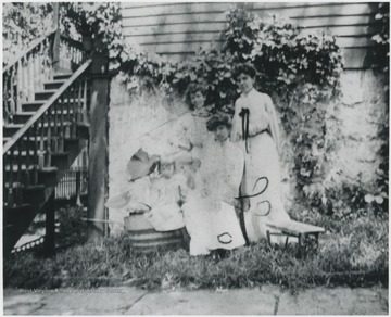 Mrs. Robert Murrell is pictured seated. The other women are unidentified. 