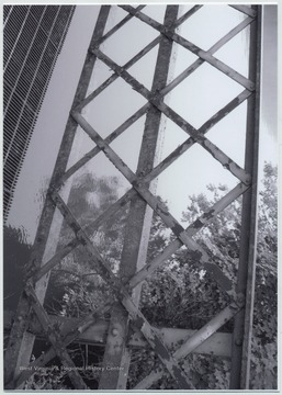 Photo showing the poor condition of the bridge over Cheat Lake. The bridge was built in 1922 by the Independent Bridge Company of Pittsburgh. It spans across the lake along County Route 857.