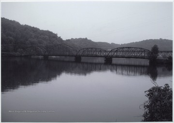 Photo showing the bridge that was built in 1922 by the Independent Bridge Company of Pittsburgh. It spans across Cheat Lake along County Route 857.