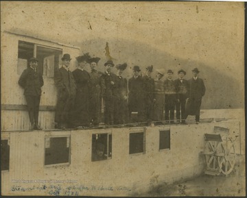 The boat traveled on New River from Hinton to Bull Falls.Pictured from left to right, an unidentified boy, , Ernest Bond, Harriett Campbell Hall, Mrs. W. H. Gwinn, W. H. Gwinn, Mrs. S. W. Poore, S. W. Poore, Oliver Graham, Mattie Graham Humphrey, Charlie Poore, Jim Gwinn, and F. H. Jennings.