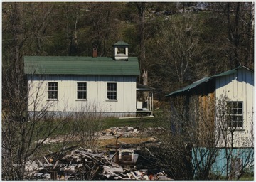 Looking at the church building located on Snowflake Quarry Road in Snowflake Village. The church is on Louis Longanacre's property. Built ca. 1900, the members who attended this church worked in the quarry. 