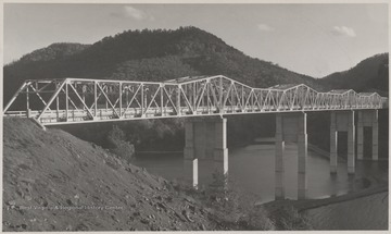 The bridge was formerly known as "Bluestone High Bridge" before its name was changed to what it is today. The structure stands tall over the river.