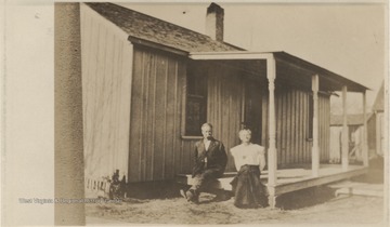 Lark and Nannie pictured sitting on the porch outside their home, where Prince and Eva Neely first set up married life. The house is located near the Larkin-Meadors store. 