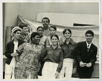 The Soul and Latin Theater group.  Bottom row from left: Jose Colon, Gwendolyn Braddock, Maria Gonzales, Norma Acevedo, Jose Mojica; Middle row: Maryat Lee, Maggie Camacho, Lucky Figueroa; Top row: Esteban Seaton.The Soul and Latin Theater was a street theater group in Harlem that performed plays dealing with cultural issues of the 1960s that were also related to the lives of the actors.Maryat Lee (born Mary Attaway Lee; May 26, 1923 – September 18, 1989) was an American playwright and theatre director who made important contributions to post-World War II avant-garde theatre.  She pioneered street theatre in Harlem, and later founded EcoTheater in West Virginia, a community based theater project.Early in her career, Lee wrote and produced plays in New York City, including the street play “DOPE!”  While in New York she also formed the Soul and Latin Theater (SALT), and wrote plays centered around the lives of the actors in the group.In 1970 Lee moved to West Virginia and formed the community theater group EcoTheater in 1975.  Beginning with local teenagers from the Governor’s Summer Youth Program, the rural theater group grew, and produced plays based on oral histories collected from the local community.  Each performance of an EcoTheater play involved audience participation and discussion.  With the assistance of the Humanities Foundation of West Virginia, guest scholars became a part of EcoTheater.