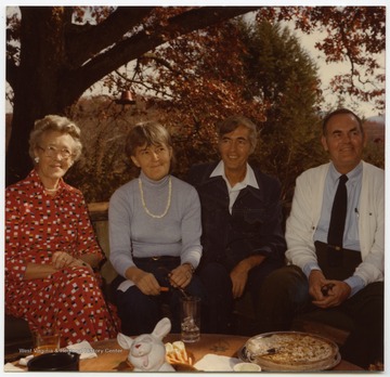 Pictured from left to right: Lee's mother Grace Dyer Lee, Maryat Lee (approximate age 55), Lee's brother Robert E. "Buzz" Lee (approximate age 58), and Lee's oldest brother John Lee (approximate age close to 60).  The Lee family is likely gathered at Maryat Lee's home, the "Women's Farm" near Hinton, W. Va.Maryat Lee (born Mary Attaway Lee; May 26, 1923 – September 18, 1989) was an American playwright and theatre director who made important contributions to post-World War II avant-garde theatre.  She pioneered street theatre in Harlem, and later founded EcoTheater in West Virginia, a community based theater project.Early in her career, Lee wrote and produced plays in New York City, including the street play “DOPE!”  While in New York she also formed the Soul and Latin Theater (SALT), and wrote plays centered around the lives of the actors in the group.In 1970 Lee moved to West Virginia and formed the community theater group EcoTheater in 1975.  Beginning with local teenagers from the Governor’s Summer Youth Program, the rural theater group grew, and produced plays based on oral histories collected from the local community.  Each performance of an EcoTheater play involved audience participation and discussion.  With the assistance of the Humanities Foundation of West Virginia, guest scholars became a part of EcoTheater.