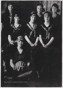 Pictured is Forward Madeline Carman, Forward Cora Litsinger, Center Rebecca Huffman, Guard Mary Wicker, Guard Fawn Rogers, and Captain Fannie Quisenberry. During the season of 1920-21, the girls finished 4-6.