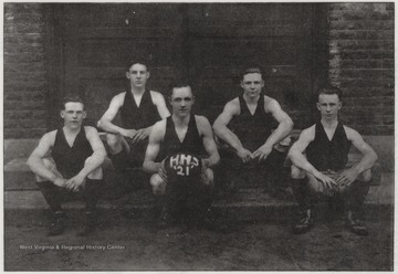Group portrait of the Hinton High School Boys' Basketball Team, featuring R. Harford (Captain & Forward), C. Harford (Forward), Falconer (Center), Fox (Guard), and Seldomridge (Guard).The team finished the season 9-9, with a total of 646 points scored.