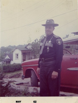 Billy Sirk, in uniform as Deputy Sheriff of Monongalia County, W. Va.