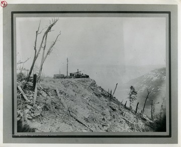 This image is part of the Thompson Family of Canaan Valley Collection. The Thompson family played a large role in the timber industry of Tucker County during the 1800s, and later prospered in the region as farmers, business owners, and prominent members of the Canaan Valley community.A skidder set, used for logging and lumber production, can be seen here overlooking the Blackwater Canyon.
