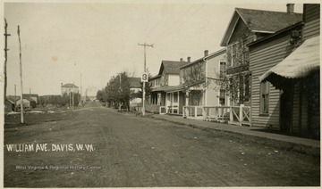 The store is located on the right corner of the avenue.This image is part of the Thompson Family of Canaan Valley Collection. The Thompson family played a large role in the timber industry of Tucker County during the 1800s, and later prospered in the region as farmers, business owners, and prominent members of the Canaan Valley community.
