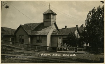 This image shows an earlier view of this church. Later, the front of the building changed and people entered through the side entrance.This image is part of the Thompson Family of Canaan Valley Collection. The Thompson family played a large role in the timber industry of Tucker County during the 1800s, and later prospered in the region as farmers, business owners, and prominent members of the Canaan Valley community.