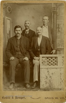 In the Front Row is F. Boxter and an unidentified gentleman. Pictured standing from left to right are Owen McCullough on the left and an unidentified gentleman to the right.This image is part of the Thompson Family of Canaan Valley Collection. The Thompson family played a large role int he timber industry of Tucker County during the 1800s, and later prospered in the region as farmers, business owners, and prominent members of the Canaan Valley community. 
