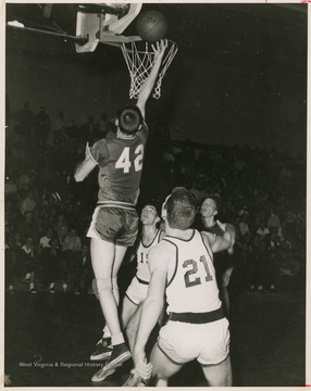 Jerry West led the East Bank High School basketball team to its first ever state championship victory as its starting small forward. He was named All-State from 1953–56, then All-American in 1956 when he was West Virginia Player of the Year, becoming the state's first high-school player to score more than 900 points in a season.West was born in Cheylan, W. Va. in 1938. After high school, he went on to play basketball for West Virginia University and then rose to fame as a player for the Los Angeles Lakers of the NBA before becoming a basketball coach and manager. 