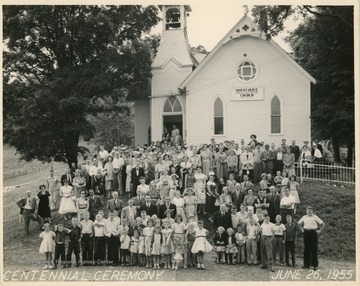 The Evangelical United Brethren church was organized in 1854.The caption written on the back of the image reads:"First row of adults, left to right: A.J. Summers, retired M.E. Minister; Rev. Donald Lockhart - the pastor in 1955; Dr. J.L. Miles E.U.B. Conference Superintendent in 1955.Just behind and to the left are two former pastors of our church, left to right: Paul Brake, Rev. E.A. Crites of Bridgeport, W. Va."