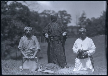 The men, which are all unidentified, pose together in their costumes. 