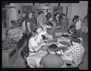 A group of female campers produce trays during their class activity. Subjects unidentified. 