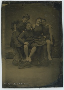 Couple on the left identified as Caroline B. Goff and Percy Goff, couple on the right is unidentified.  All appear in swimwear.