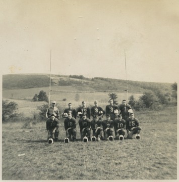 Fred Carrol, top left, poses with his football players, including Arthur Sisler (No. 9), Frank Lambert (No. 3), Richard Fraley (No. 18), and Paul R. Cooper, Jr. (No. 17).