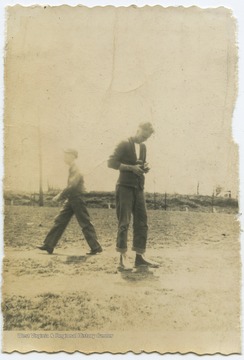 An unidentified boy looks into a camera. 