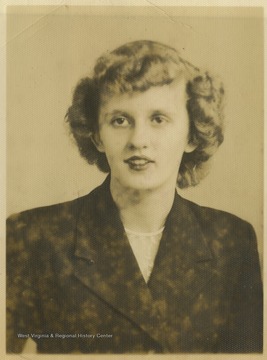 An unidentified female student poses for her school photo. 