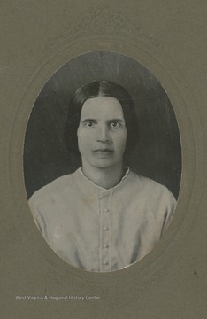 Description on reverse reads "Mrs Mary M Lightner. No R.F.D. No. 9.  Black eyes. Dark brown hair. fair and [illegible]. [illegible] waist."
