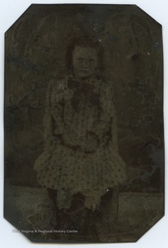 Kidwell (b.1876-d.1946) is about 6 years old in the photograph. 