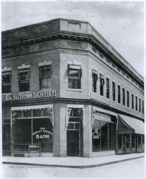 Photograph taken in the early 1900's shows the entrance to the Beckley National Bank, as well as Dr. Sutphin's dentistry.