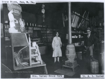 Mrs. Barney Evans Gore, left, and Dr. A. L. Hunter, right, are pictured inside the store. 