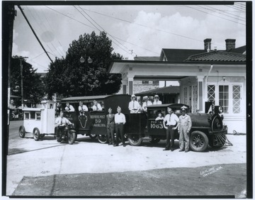 A group of men wearing hats are pictured beside and inside what appears to be a street train, but is likely an automobile and wagon disguised as a train. Red Devil Post 59 is likely a group within the American Legion.