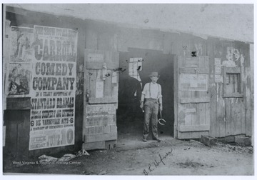 Hefner is pictured holding tools and a horseshoe at the entrance of his shop. A horse is seen inside his shop.  The Carroll Comedy Company broadside likely advertises a June 10, 1900 performance.