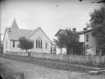 Street view of the church, pictured on the left, and the parsonage, pictured on the right. 