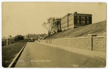 A view of the WVU campus looking down Maiden Lane, featuring Stalnaker or Women's Hall and Oglebay Hall in the distance.