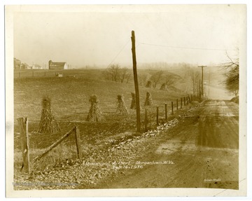 An early view of the site of the Morgantown Municipal Airport during construction. Text on back reads, "Municipal Airport: Road location from U. S. 119 - along second fence line."