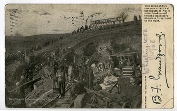The caption reads: "This scene shows rescuers at work at the mouth of No. 8 mine: broken and twisted machinery shown in foreground to the right."