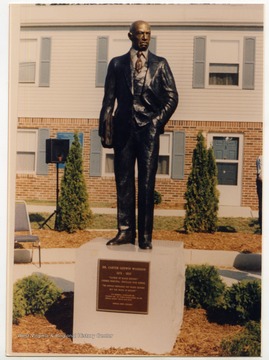 A statue of Dr. Carter Godwin Woodson.The plaque reads: "Dr. Carter Godwin Woodson, 1875 - 1950. 'Father of Black History.' Former Principal - Douglass High School. 'We should emphasize not Negro history but the Negro in history.'--CGW Memorial Foundation Inc.Founded 1986 by former Mayor Robert Nelson.Special Thanks - Mayor Jean Dean.-- Newatha Perry, President"
