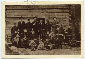 Many of the pictured Hatfields are armed with various guns.