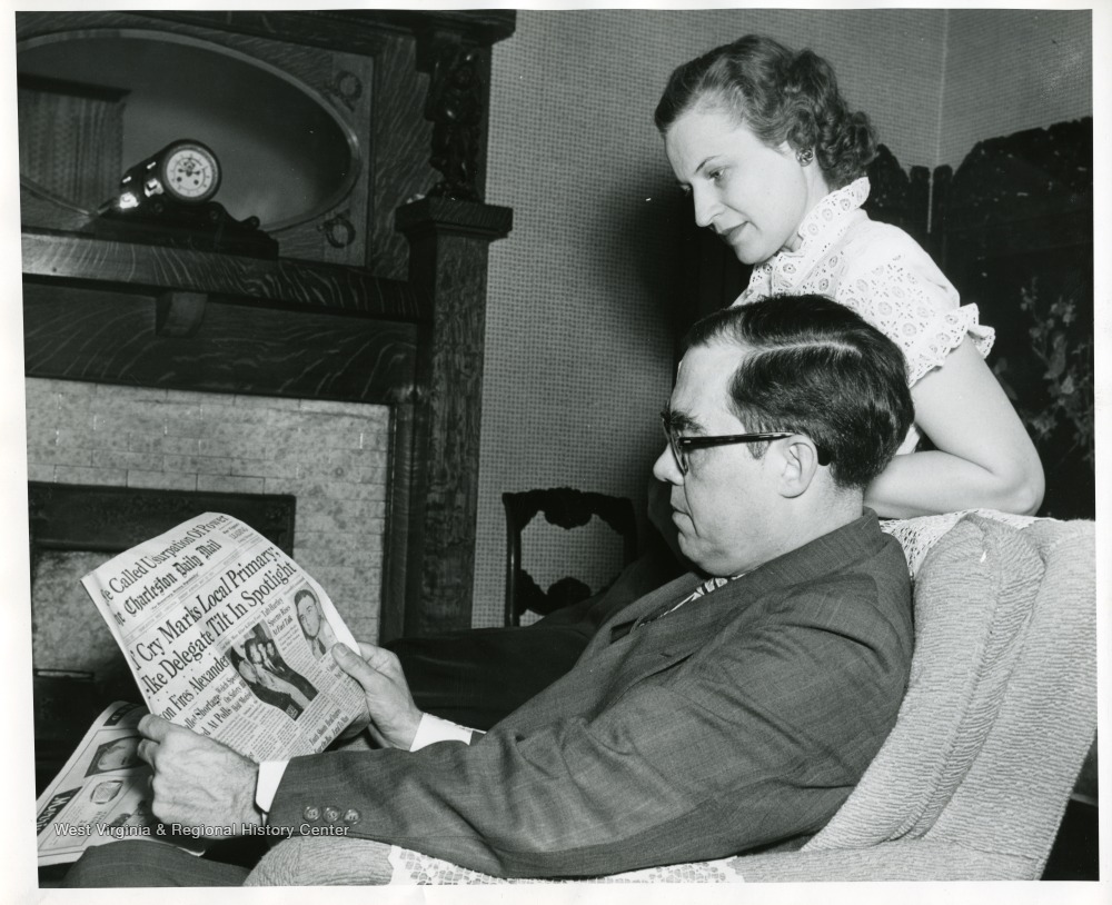 Senator Rush D. Holt and his wife, Helen, are reading the Charleston Daily Mail.