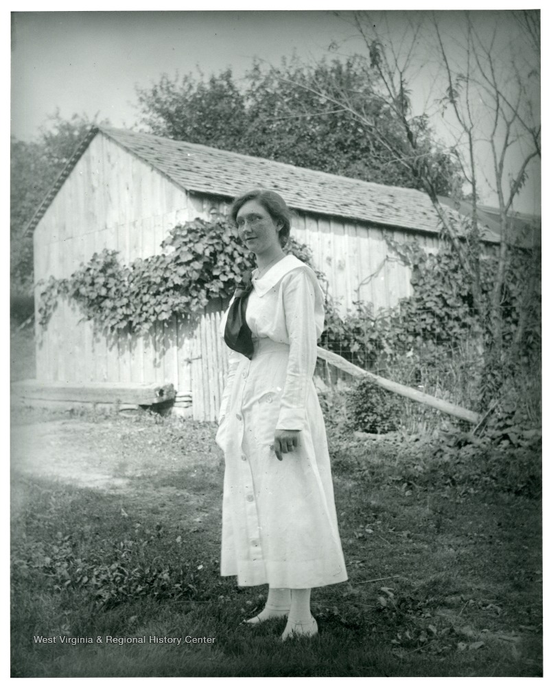 Anna Sutton is standing near a barn in Helvetia, West Virginia.