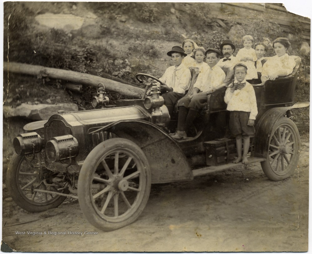 'First car to Crow, W. Va. Walter Dudley and family of Glen Morgan, Permission Postmisstress at Crow. June 11, 1910