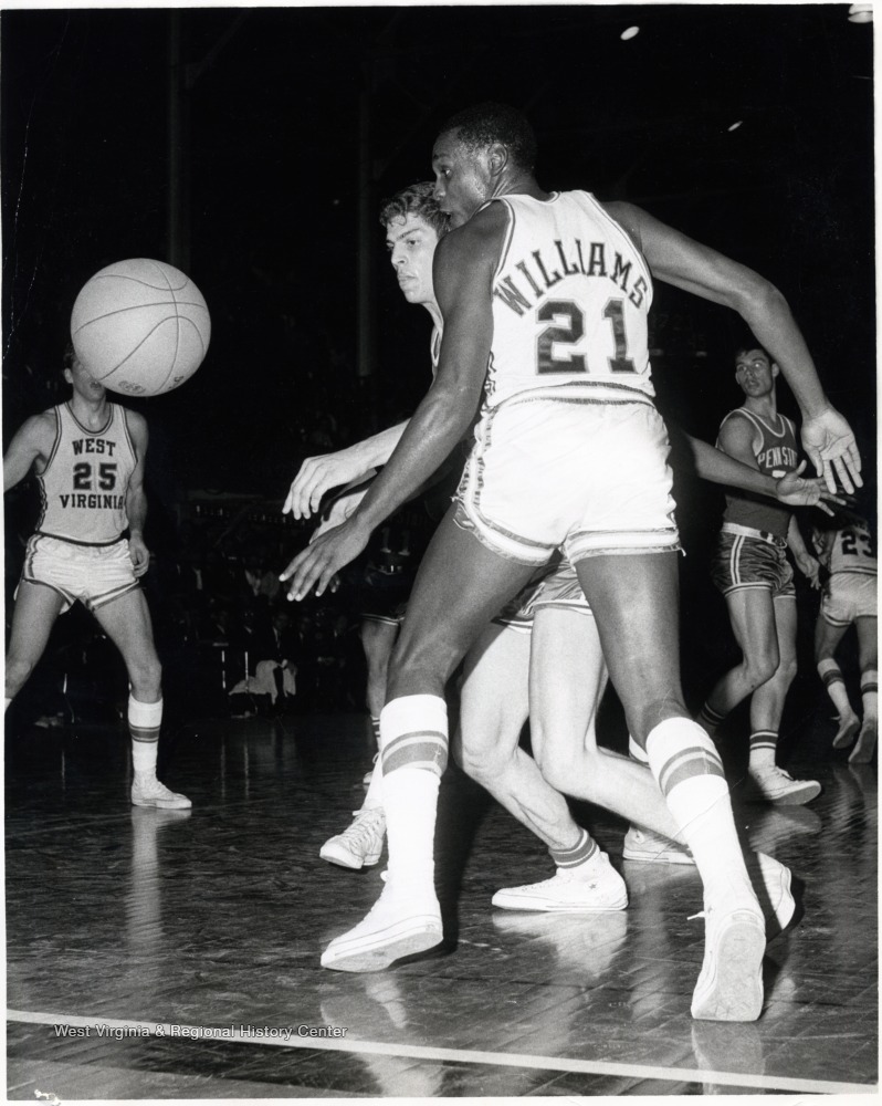 WVU Basketball Player Ron Williams (21) Goes for the Ball vs. Penn