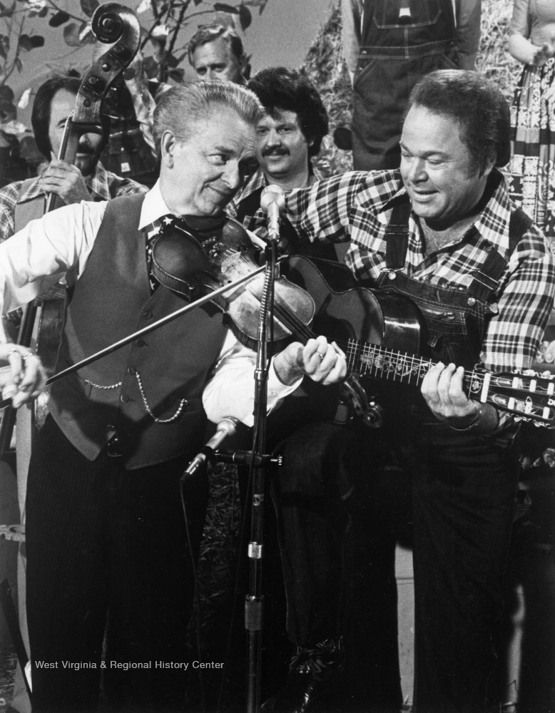Byrd plays a tune with Country singer Roy Clark on the popular TV show "Hee Haw".'Originals moved to R.C.B. Center for Legislative Studies, Shepherd University; digital.'