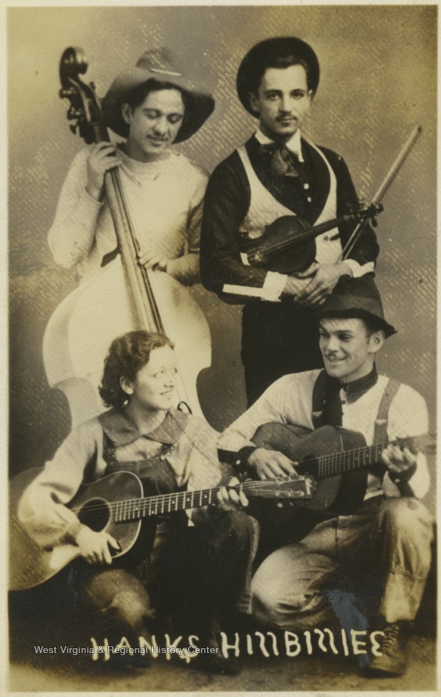 Four country musicians holding their instruments - guitars, upright bass, and violin (fiddle).