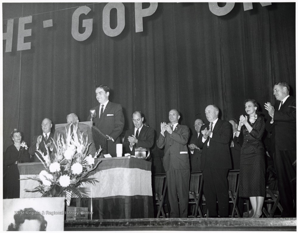 'Foreground - Governor Cecil Underwood; Background (Left to Right) - Mrs. Cecil Underwood, (?), Senator Chapman Revercomb, (?), Senator John D. Hoblitzell, Jr., (?), (?), (?)'