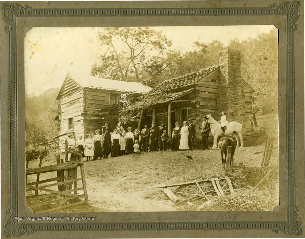 A family photograph of Jake Keatley's family on Keatley Farm, no members are identified. The farm was located in the Forest Hill District. Inscribed on the back of the photograph: "Hinton Daily News Collection from Jim Pettrey to Stephen Trail 11/16/1996".