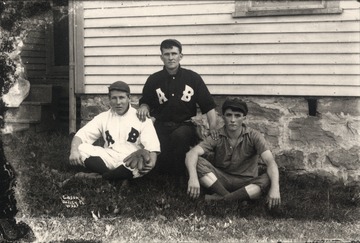 Two players wearing uniforms with the letters "A" and "B", possibly from Preston County.