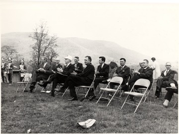 Portrait of dignitaries sitting in chairs on a hillside. Cass, WV; John P. Killoran, Promotion Officer, WV State Parks, Chas, WV 25305