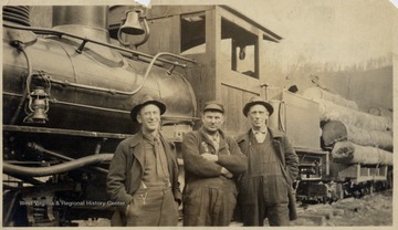 Engineer (Frank), fireman (Jim), and brakeman (Dan) on Climax locomotive and a load of logs.
