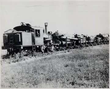 No. 2 Climax Engine pulling lumber carts.