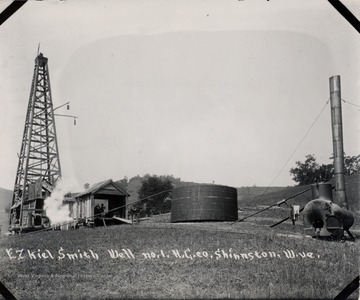 Oil derrick, storage tank, and other equipment.