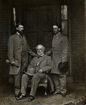 R. E. Lee, seated between two officers.